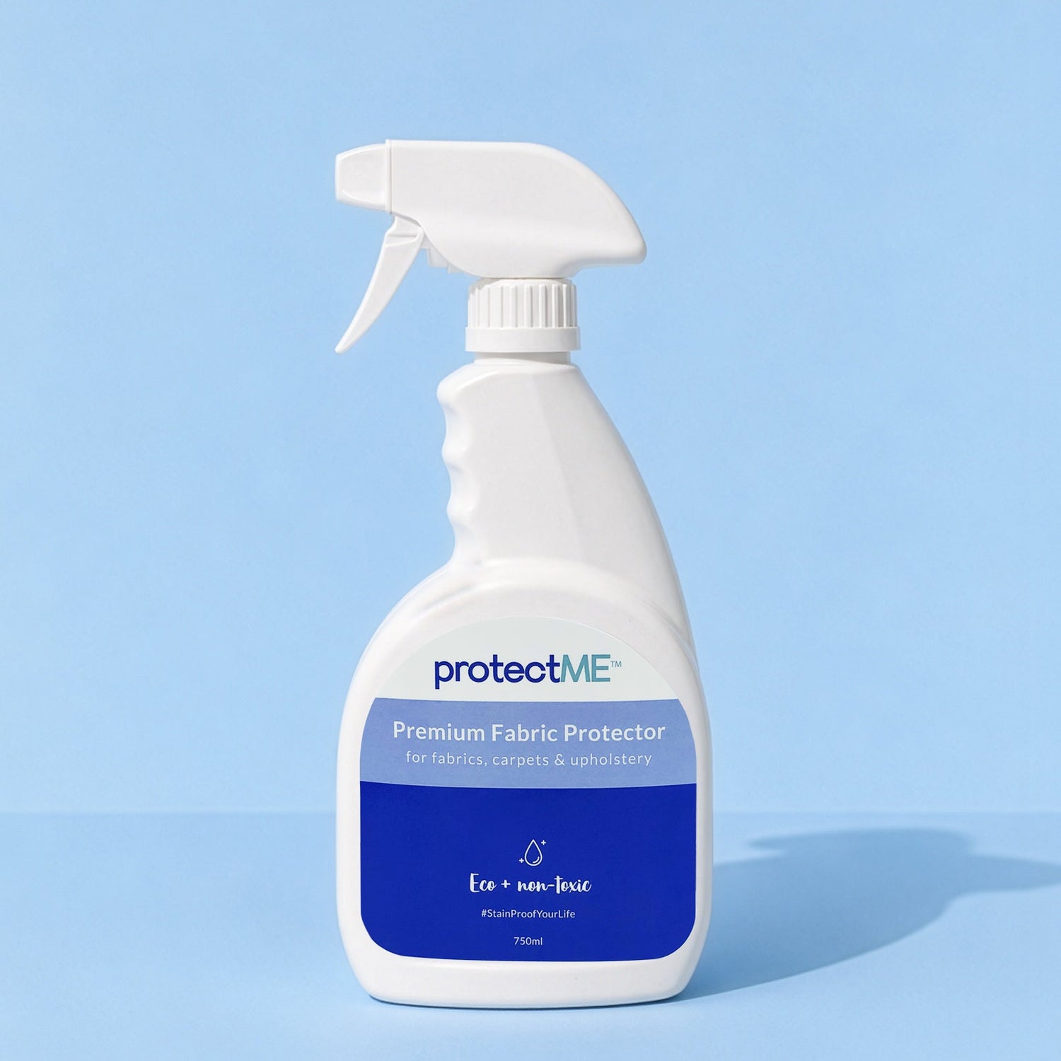 A white trigger spray 750ml bottle of protectME Premium Fabric Protector, set against a solid light blue background.