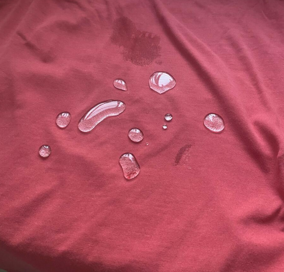 droplets on red fabric after use of protectMe 